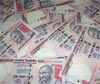 Desperate rupee hits a record low of 58 a dollar