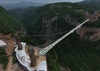 Chinese officials drive two-tonne truck onto the world’s highest glass bridge in safety test